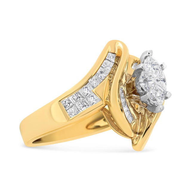 This diamond engagement ring features a central marquise-shaped diamond set within a 14 karat yellow gold band. Baguette...