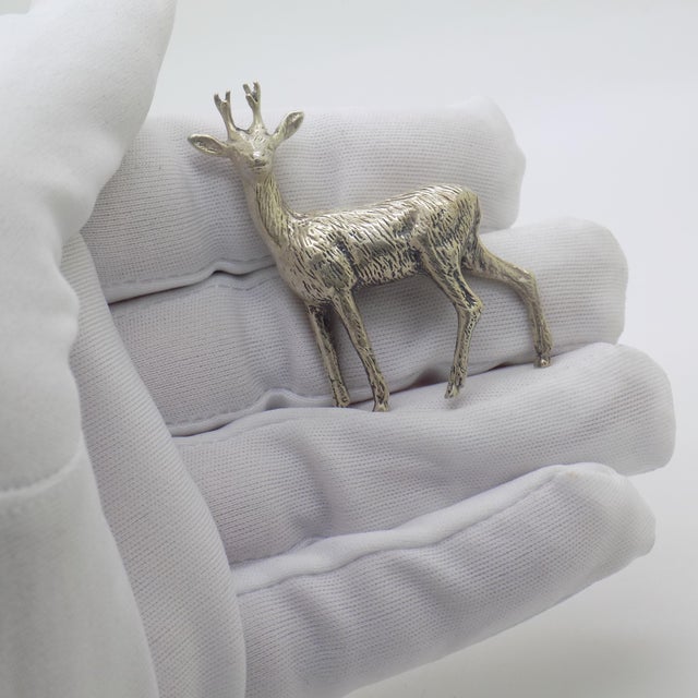This vintage silver decorative object depicts a detailed young deer figurine miniature, crafted as a dollhouse...