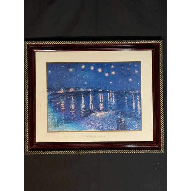 Framed Vincent Van Gogh “Night Stars” reproduction print featuring deep blue nighttime tones, glowing star reflections, a...