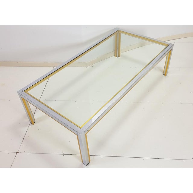 This brass and chrome table by Renato Zevi, is a decorative piece that fits in both modern and eclectic interiors. 1970s....