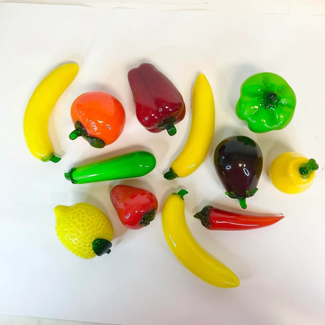We love these blown and pressed glass set of 12 glass fruit and vegetables. The lemon, orange and strawberry are a...