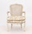 Louis XV Style Cane Paneled Back Fauteuil, the upholstered seat with Chinoiserie style pattern, the frame white painted...