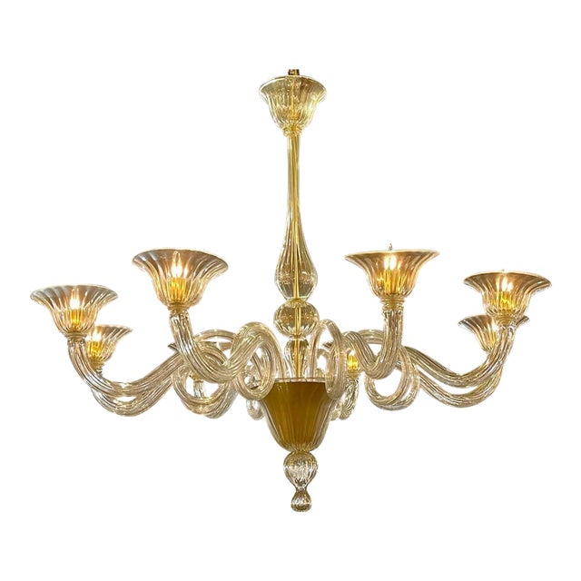 Gorgeous pair of Modern gold Murano glass chandeliers. Beautiful glistening glass and curly-que arms. These are extra...