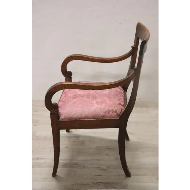 Beautiful late 18th century of the period Directoire Italian antique armchair in solid walnut wood. The armchair is very...