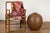 A contemporary Prem Collection artisan handcrafted ceramic vase with brown textured finish, round shape, honeycomb style...