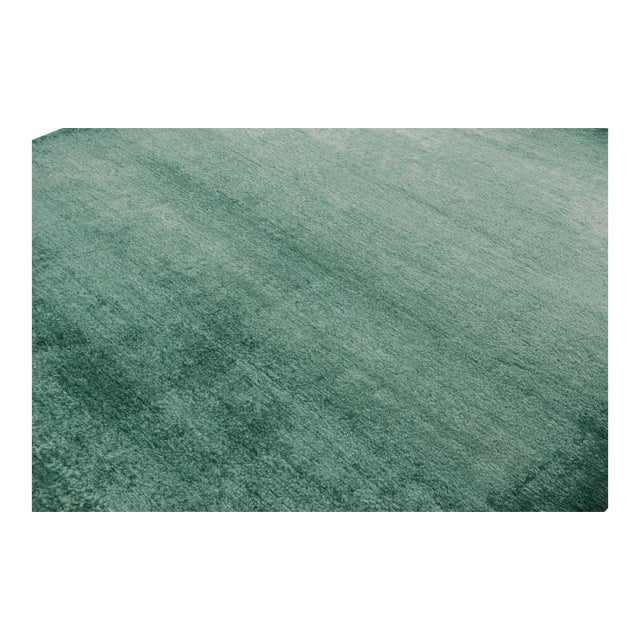 Hand-knotted in a luxurious pashmina, this 8x10 textural high-pile rug is a simple piece of neutrals and teal blue and...