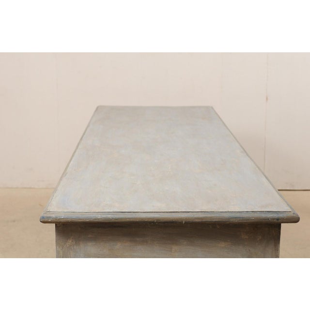 A large-sized American custom kitchen island table with drawers. This impressive table has been fashioned from old...