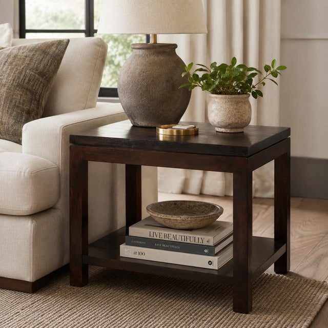 A clean-lined Williams-Sonoma Home end table featuring a rich espresso walnut finish, thick square top, and open lower...