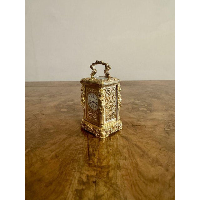 Beautiful quality antique Victorian ornate brass miniature carriage clock, having a beautiful quality antique Victorian...