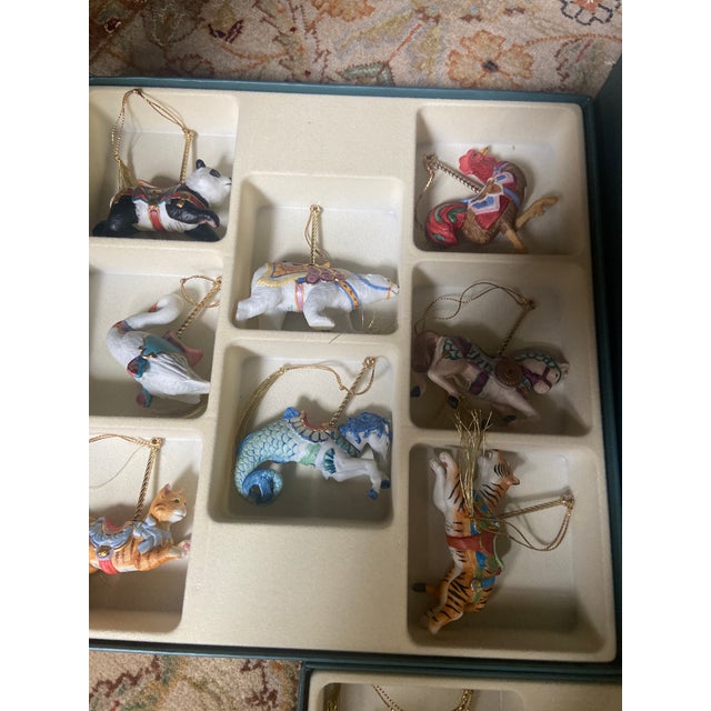 24 Ceramic hand painted Carousel Christmas ornaments. Original box . No damage and all have gold tassels to hang on your...