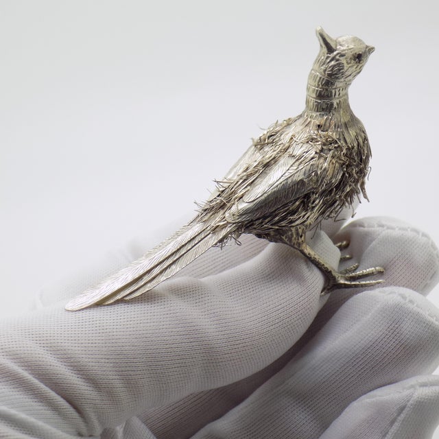 A delicate and harmonious vintage sculpture depicting a bird with finely worked silver plumage, handmade in Italy between...