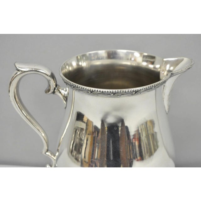 Vintage N.S. Co Victorian Bulbous Silver Plated Lemonade Beverage Water Pitcher. Circa Mid 20th Century. Measurements: 8"...