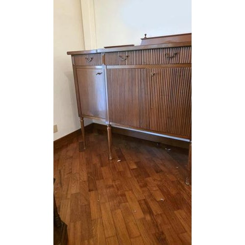- An elegant and spacious sideboard dating from the 1960s, crafted from solid wood with a glossy finish. The piece...