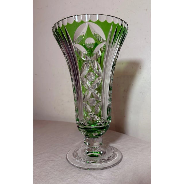 This lovely crystal example features a vibrant green color done in cut to clear style with intricate design throughout....