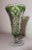 This lovely crystal example features a vibrant green color done in cut to clear style with intricate design throughout....