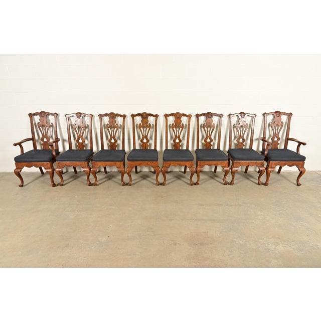An outstanding set of eight Chippendale or Georgian style dining chairs By Henredon USA, Circa 1980s Carved solid oak...