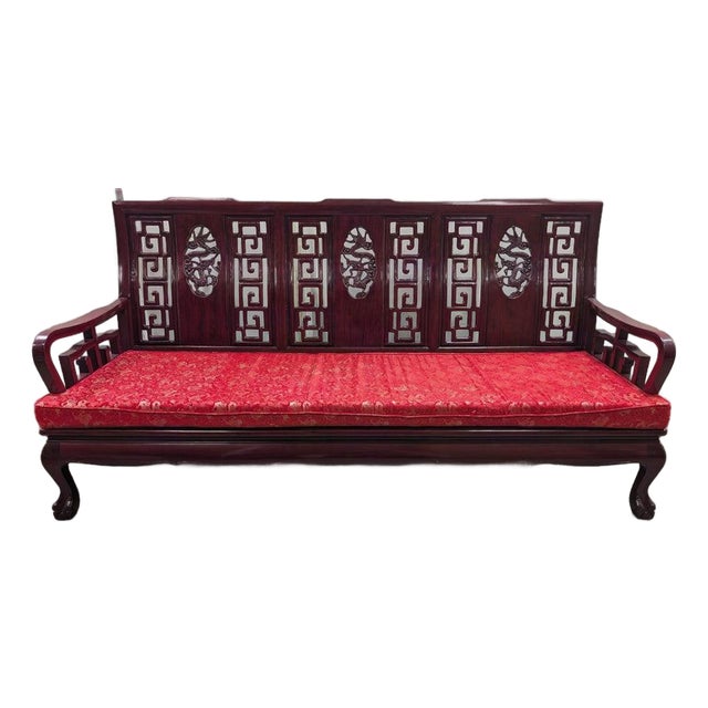 Vintage Chinese Rosewood Three-Seat Sofa With Hand-Carved Dragon Medallions and Red Silk Cushion For Sale