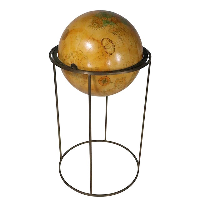 Mid Century Replogle globe, mounted of a squared brass stand, design attributed to Paul McCobb. The globe is 16" in...
