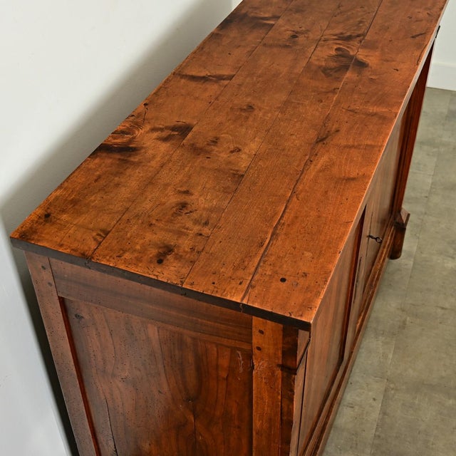Dimensions: 43 ¼” H x 59 ½” W x 22 ⅝” D A charmingly patinated solid walnut buffet, exhibiting French Empire confidence...