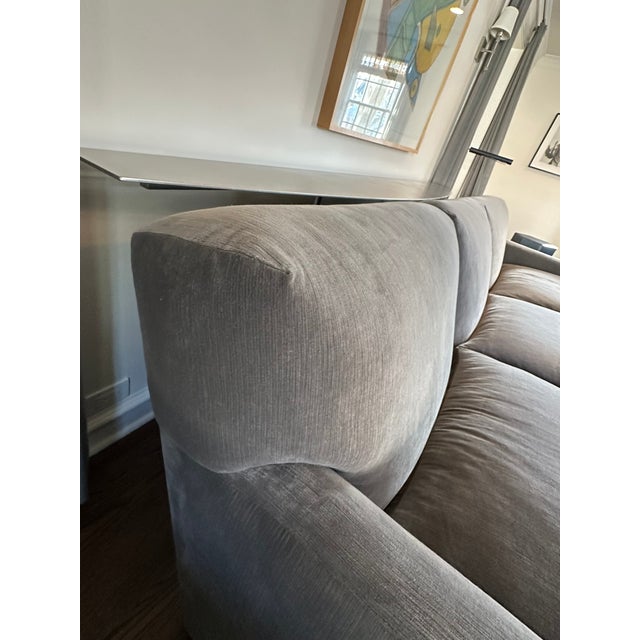 Elevate your living space with this modern gray upholstered sofa, a versatile piece that blends comfort with refined...