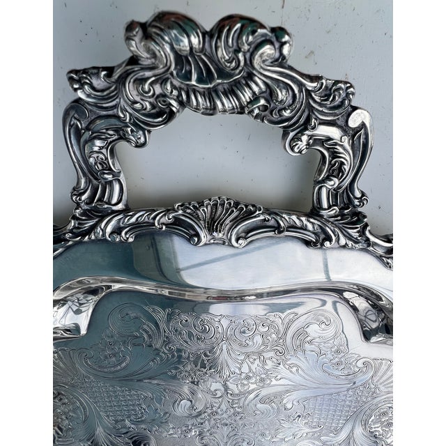 Elevate your home decor with this exquisite silver tray and it’s impressive size. Vintage Community "Ascot" pattern...