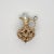 A vintage 14 karat gold charm for a charm bracelet. In the form of an intricate filigree pitcher or wine ewer with a pearl...
