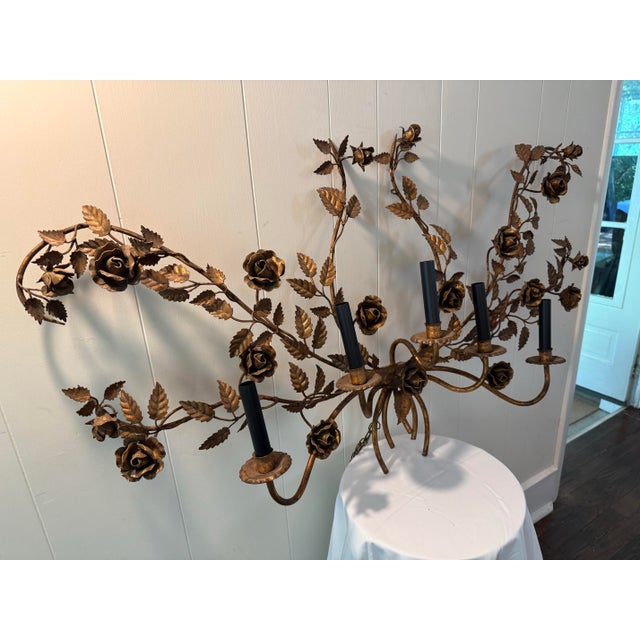 Monumental vintage Italian gilt tole wall girandole featuring hand-formed roses, scrolling vines, and five electrified...