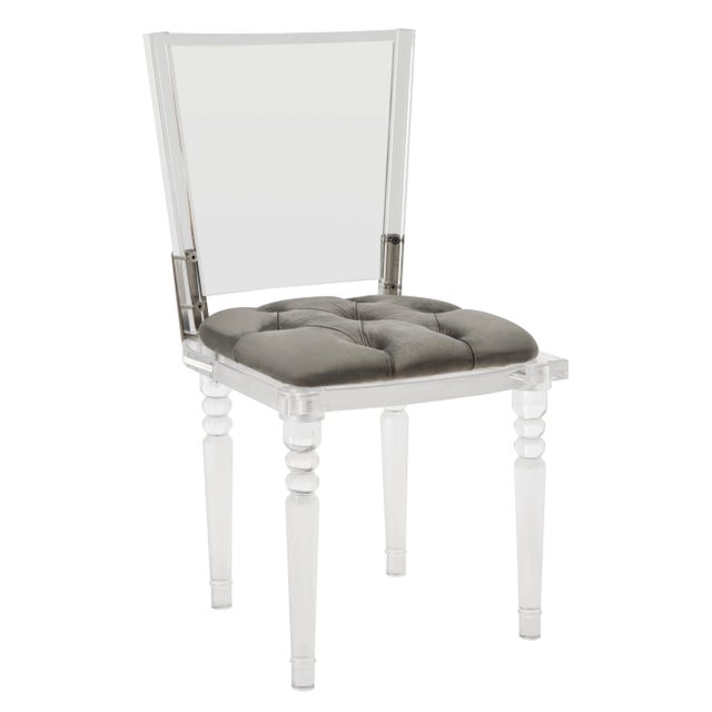 char and chic, this contemporary acrylic dining chair lends a modern spin to classic French style. Finely crafted with...