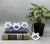 Charming set of four vintage ceramic napkin rings with a classic rope-and-bow motif in crisp white glaze. The sculpted...