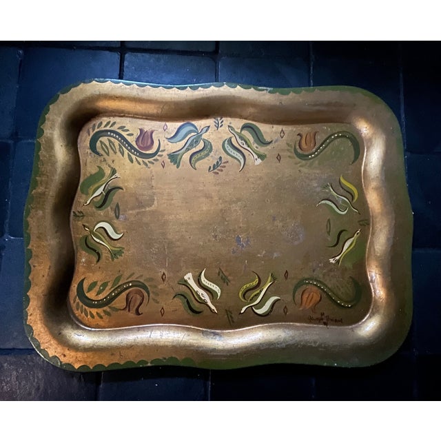 Vintage hand painted Toleware tray by Georges Briard, featuring a folk art and floral motif. Signed lower right.