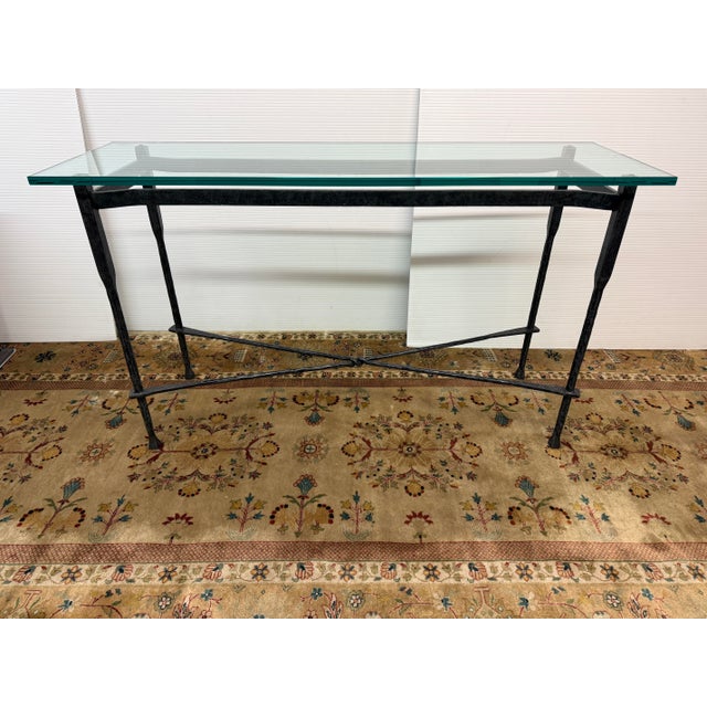 Design Plus Gallery presents a Console Table in the Style of Giametti. The console has a slender, hand-forged wrought iron...