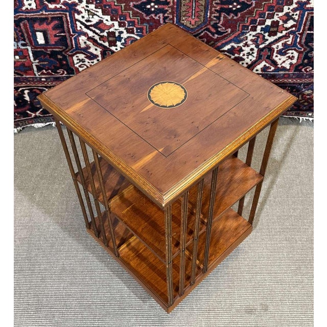 English rotating yew bookcase from the 1970s - H=80cm, W=50cm, D=50cm.
