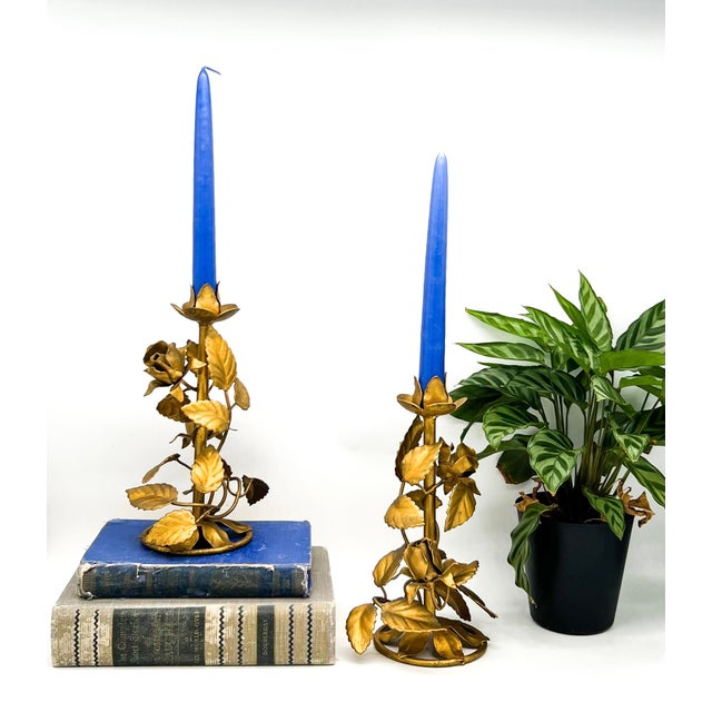 Charming vintage Italian gilt tôle candleholders featuring sculptural roses, buds, and layered foliage. Beautifully...