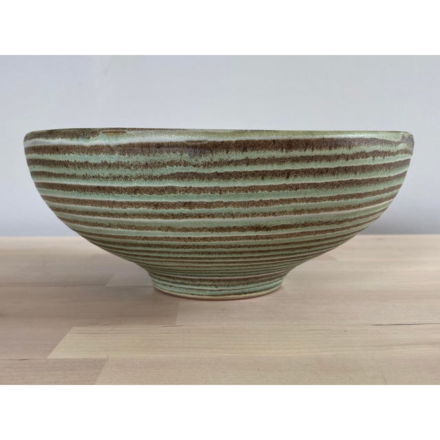 A stunning mid-1950s pottery bowl designed by Lee Rosen for Design-Technics. This bowl features one of Design-Technics...