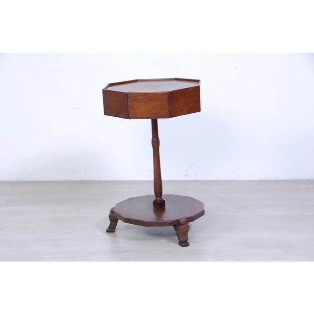 Beautiful wooden table, production of the early 1900s. Dodecal base supported by three feet. Wooden auction that is fixed...