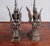 A pair of bronze sculptures which have been fitted for use as lamps. Each sculpture depicts a mythical creature with the...