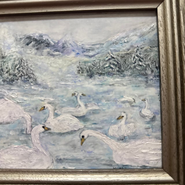 This evocative original oil painting captures a serene winter scene of a gaggle of swans gathered on a partially frozen,...