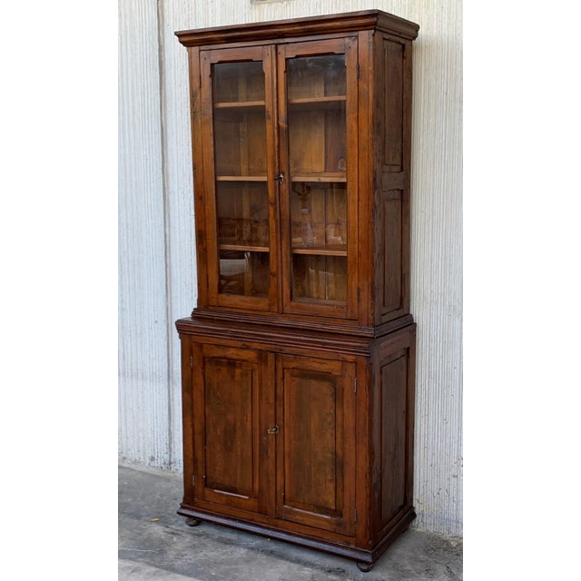 About Absolutely gorgeous vitrine cabinet from Spain. In two parts. Originally used as a bookcase. Stunning patina, with...