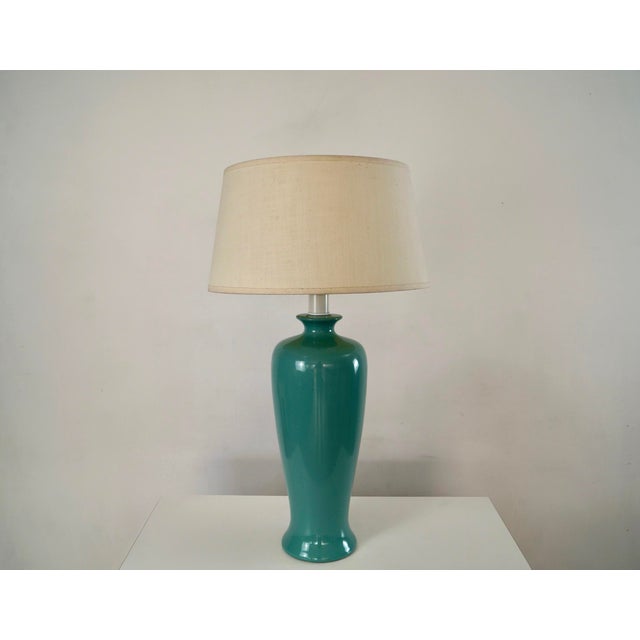 Vintage 1960's Mid century Modern table lamp for sale. It's made of ceramic, and has a beautiful 60's teal color. It was...