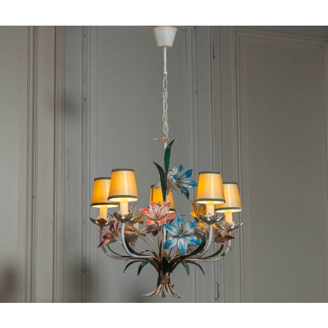 This stunning Italian chandelier from the 1950s features an intricately designed metal frame with hand-painted polychrome...