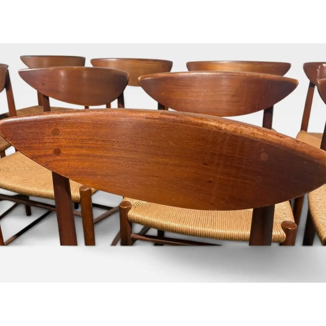 We are pleased to present a rare set of 10 Danish teak and cord dining chairs. This design is Model 316 by Peter Hvidt &...
