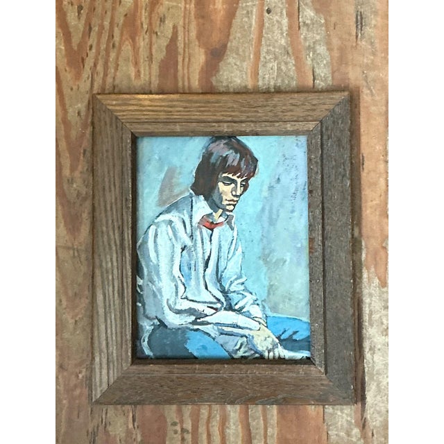 This evocative 1970s oil painting captures a seated man in a state of quiet contemplation, rendered with expressive...