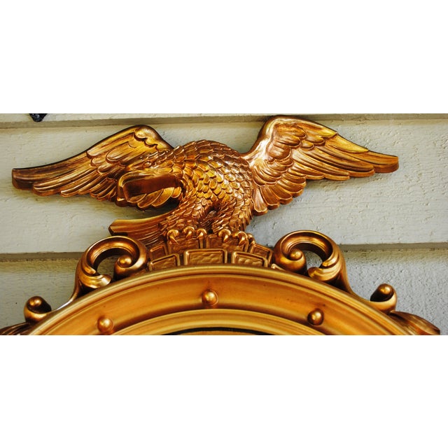 This federalist eagle "bulls eye" convex mirror is a size that will fit well in most any space. It has the 13 dots around...