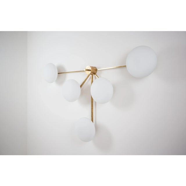The Stella Fan Wall / Ceiling Light brings elegance to midcentury design through the inspiration of Italian design -...