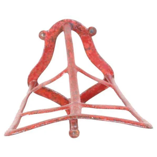 An unusual side saddle rack. This type of fixture was fastened to the wall in horse barns and used to hold a lady's riding...