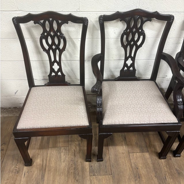 This is a complete set of four gorgeous vintage carved Chippendale dining chairs with two arm chairs or captains chairs...