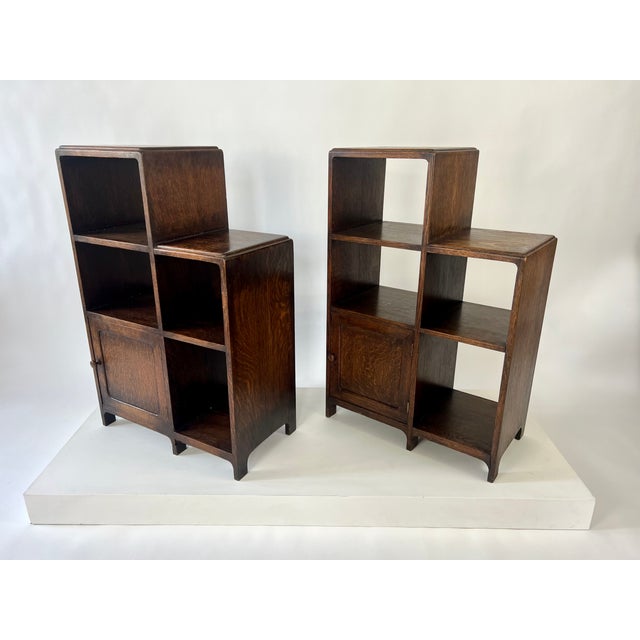 Pair of modernist art deco bookcase / shelving unit in oak. English, c.1930 Asymmetric design with a stepped profile and...