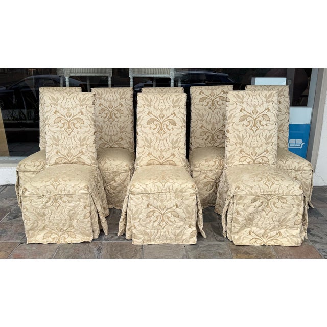 Design Plus Gallery presents a Set of Eight Slipper Style Dining Room Chairs from Sunrise Home. The chairs have high backs...