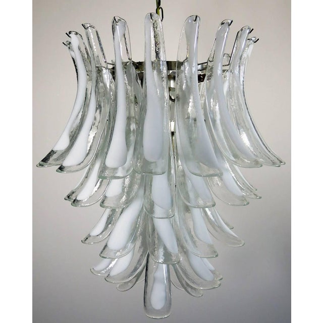 Pair of huge Italian vintage Murano chandeliers made up of 52 glass petals (transparent crystal, smooth outside, with...