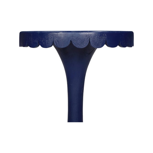 Crafted from natural wood, this scalloped accent tables add a joyful pop of color and character to any space. The softly...